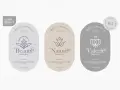 Trzy etykiety kosmetyków organicznych: "Beauty", "Nature" i "Valera". Każda zawiera logo, slogan i listę składników, podkreślając naturalne pochodzenie i wysoką jakość produktów.